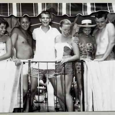 "This motley crew rented the pontoon boat in Macatawa and came down to Douglas beach. Pretty sure it was 1956. From left: Laurie McCaskill of St. Louis, Ken Isphoriding of Cincinnati, Walt Ekins of Cincinnati, Heather Heuchan, Jeanne von Brecht of St. Louis, Bob Castelline of Cincinnati, Ted McCaskill of St. Louis. Beer was consumed although no one was 21.