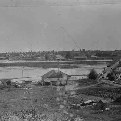 st107 Birds Planing mill.jpg 790KB: Similar view, earlier year judging by lack of trees on the causeway. Jack Sheridan confirmed this is not the Bird's Planing Mill in 2023. From the RJ Peterson collection/Digital file from Jack Sheridan Drive 2021.72.02