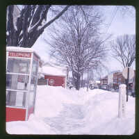          Corner of Butler and Culver from sidewalk in front of the Village Hall. Sand Bar sign visible down the street
   