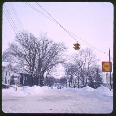 The only stoplight in town at the intersection of Culver and Butler. Rich's Pie Factory building (Fruit Exchange) visible down the street.: Shell sign from Force's Snug Harbor gas station at 201 Culver Street.