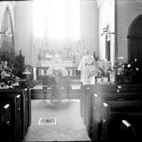          1899_Episcopal_Ch_inside.jpg 600KB; Digital file on Jack Sheridan Drive 2021.72.02
church interior with gothic details, possibly Easter due to lilies and palms
   