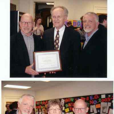 Ken Carls (striped shirt) and James Schmiechen (plaid shirt) receiving awards, possibly 2004