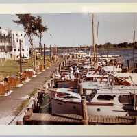          excellent color photo of boardwalk and docks behind Butler Hotel
   