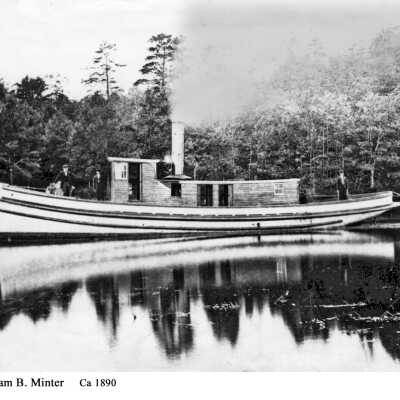 The William B. Minter was a 53’ early steam tug built by James W. McMillan in 1868. She was first owned by “Captain Billy” Minter, then sold to O. R. Johnson and participated in the transport of the Johnson lumber mill from Singapore to Mackinaw in 1876.: filename: cW_B_Minter