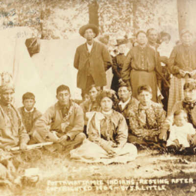 Digital only: same image without Saugatuck inscription: According to http://markmaynard.com/2014/04/the-often-overlooked-native-american-history-of-ypsilanti/
1909 photo of a Potawatomi community, “after a dance,” in Athens, Michigan. According to Matt, “These are the direct descendants of the Potawatomi of the Huron River. They escaped forced removal in 1840-41 in Kansas, and returned to Michigan.” The image is from the family of Abram B. Burnett, Chief of the Potawatomis (1812-1870).