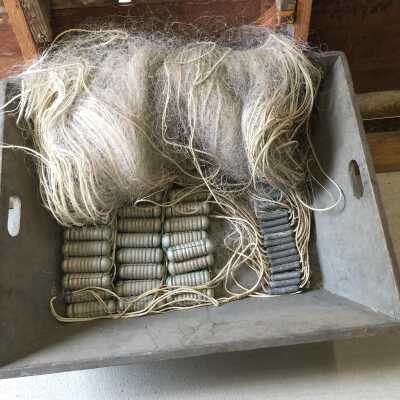 Complete gill net with floats (at left) and weights (at right)