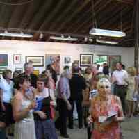          IMG_1609.jpg 2.8MB; Ox-Bow summer fundraiser silent auction. At left, Ellen Sprouls dressed in beige and covering mouth, George Brown in yellow polo shirt, Pat Dewey in pink/orange florals in front of Lesa Werme,  Mike and Theresa O'brien standing by pole, Cynthia McKean in orange. Photo timestamped July 8, 2006
   
