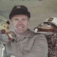          Dick Hoffman on board the Island Queen with Kukla the clown and Ollie the dragon.
   