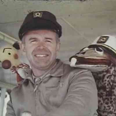 Dick Hoffman on board the Island Queen with Kukla the clown and Ollie the dragon.