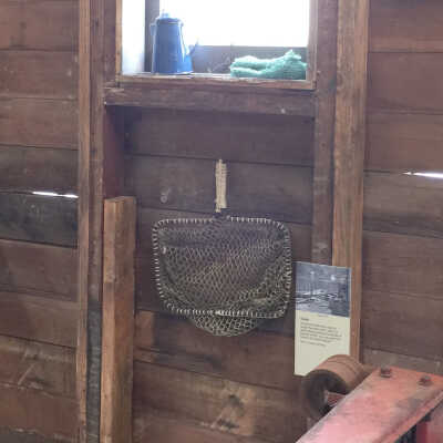 Hand net to dip bait fish out of a tank