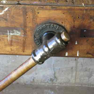 Ohio Tool Company bench screw with wooden handle.: https://www.1stdibs.com/furniture/tables/industrial-work-tables/antique-carpenters-workbench-circa-1900-ohio-tool-company/id-f_7760373/