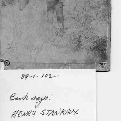 89-1-102_Henry_Hankins.jpg 593KB: Back says Henry Stankaux takein Granite Falls, Minn. Front Henry Hawkins or Hankins - a young man holding a watermelon or a very round rock.