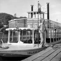          154; This image was featured as History Mystery #76 with the solution: Dick Hoffman was one of Saugatuck's early tourism promoters and mayor.
   