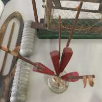          Inkwell jar with four red model buoys. Two buoys have been moved to the SDHC archive to be kept with the net reel model, 2021.06.08. (Aug. 2021)
   