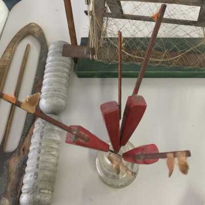 Inkwell jar with four red model buoys. Two buoys have been moved to the SDHC archive to be kept with the net reel model, 2021.06.08. (Aug. 2021)