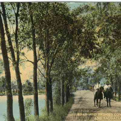 CWPC-0230Bridge.JPG 520KB: Swing bridge causeway with trees, unpaved this horseback riders, possibly Twin Gables in background on left