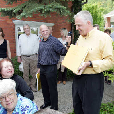 Ken Carls presenting his companion book for the exhibit at the opening party