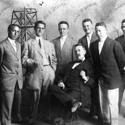 Book 2003 5.49 -- men posed with Mount Baldhead studio background: 576 KB