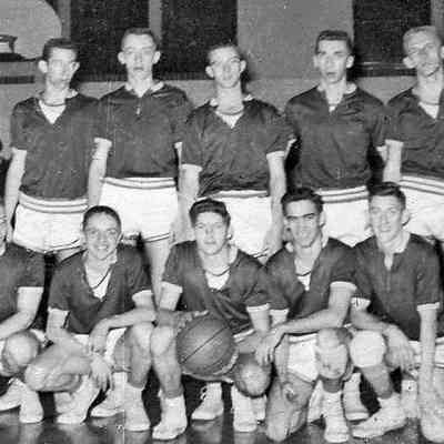 SHS1957Basketballteam.jpg 216KB: 1956-57 SHS Basketball Team
Thanks to Jodi Goshorn for sharing this photo of the 1956-57 Saugatuck High School Basketball team. Coached by Bud Whipple and Captained by her late husband Stanley (holding ball), varsity members included Ralph Birkholtz, Victor Mayer, Frank Lovejoy, Chuck Schoppe, Bob Brackenridge, Harvey Slotman, Bill Hedglin and Frank Lamb. Saugatuck was the smallest school in the Allegan-Van Buren League that year with 84 students in the top four grades.
The April 5, 1957 Commercial Record, covering the annual Rotary Banquet for Basketball Teams and Coaches, reported that the Saugatuck team was "District Champion" finishing 5th in the Al-Van league. Their season record was 11 wins and 10 losses.
Stanley was his SHS senior class Vice-President, and went on to serve in the U.S. Navy. He retired from both the Saugatuck Fire Department and the Allegan County Road Commission. A resident of Saugatuck, he and Jodi had been married for 44 years when he passed away in 2005.
--contributed by Chris Yoder, Aug 2009
