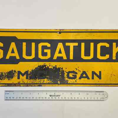 Metal sign, Saugatuck directional