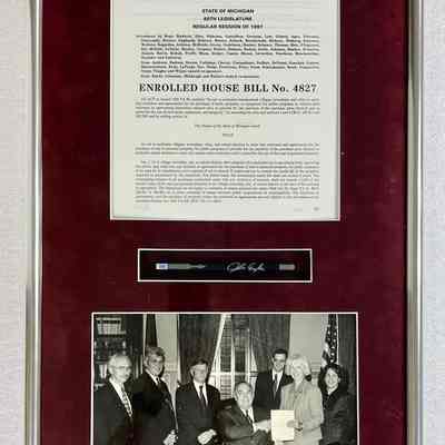 L. Enrolled House bill No. 4827 with photo and pen. 1997: Photo of Birkholz with Michigan Governor John Engler. 26x14x2"