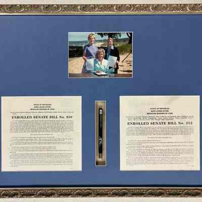 M. Enrolled House bill No. 850 of 2006 and 212 of 2008 with photo and pen.: Photo of Birkholz with Michigan Governor Jennifer Granholm. 19.5x25.5"