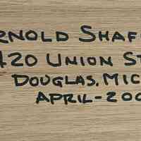 Builder's name written on bottom of base.
