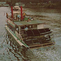          Island Queen underway, stern view of paddles; 48833-C Dexter Press/Penrod Studio, Berrien Center, Mich.
   