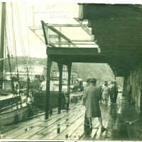          Pavilion dock by Simmons ca 1952; People and sailboats at the Pavilion Dock
   