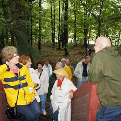 Jim Schmiechen welcomes a tour group into the Tallmadge: Photo by Charlie Terry