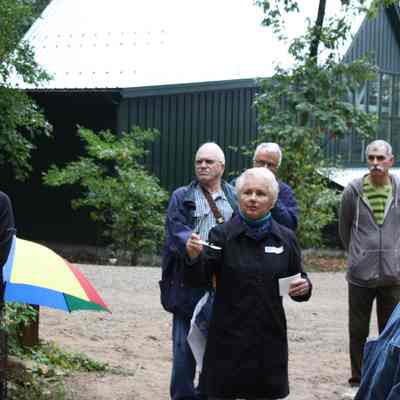Patty Birkes concludes the tour outside the ceramics building: Photo by Charlie Terry