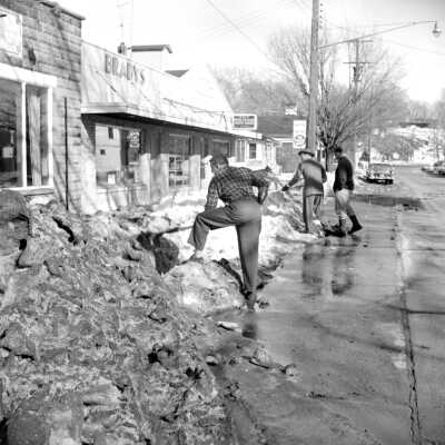 Across the street from the Fruit Exchange in front of the Gourmet Shop. Billy Wilson in foreground.