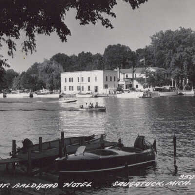 Real photo card of Mt. Baldhead Hotel with ferry crossing and boats docked in foreground: 350-C  by L.L. Cook Card Co., Milwaukee