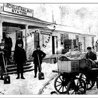          Snow shovelers at Saugatuck Interurban Station; filename: Interurban station slide
   