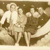          MF-0018.jpg; Family sitting on the moon photo
   