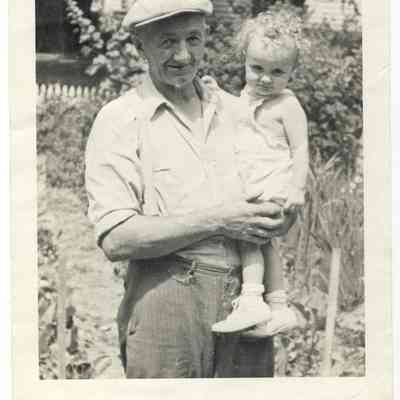 MWM-FrankWicks-gdNancy.JPG 557KB: Frank Wicks and granddaughter in yard at Maplewood, Wickwood in back