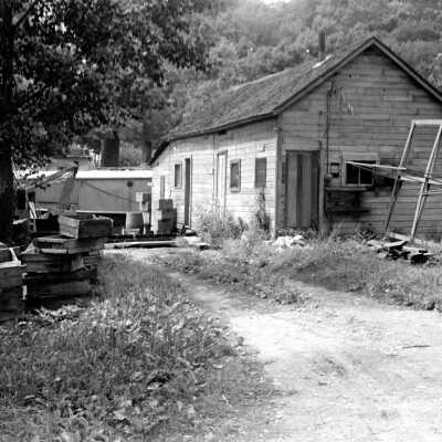 105: This image was featured as History Mystery #10 with the solution: The Village pumphouse, the Gotham fish tug and the Sewers fish house as seen from Water Street ca 1943.