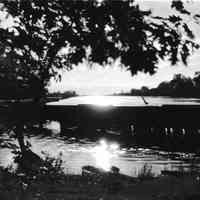          95 84 16 Old Harb twilight .jpg 677KB; Box 31, envelope 95-84-16. A sunset glistens on the Old Harbor. Photo taken from the shore at Ox-Bow with the channel walls still robust.
   