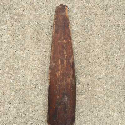 Float used in hook line fishing. Linseed oil treated wood. Metal ring at top.: Hung inside the Demerest Shanty, May 2021