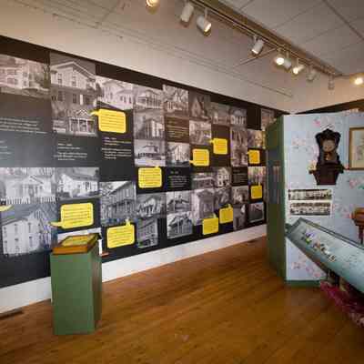 Yellow dialog bubbles on exhibit west wall