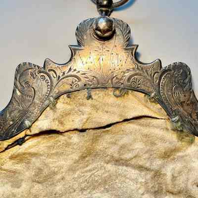 close up of clasp front with stylized birds