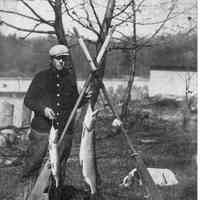 Ross Phelps with oars and fish