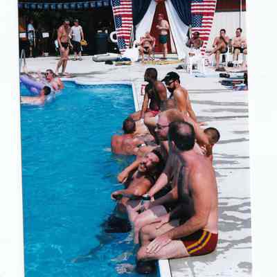 Camp_It5.jpg 465KB: Men sitting and chatting by the edge of the pool