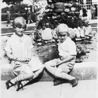          Irene Jr. & Bob sitting infront of porch 1927.jpg; Location is likely the Getz Lakewood Farm/Zoo in Holland
   
