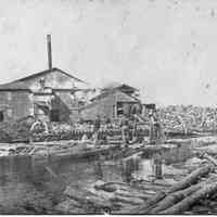          89-1-65_B_Basket_factory.jpg 1.2MB; 89-1-65 workers guiding logs from the boom into the sawmill
   