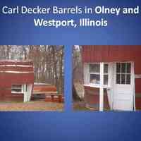          Joe Decker got this idea from his brother Carl Decker who had actually built two of these barrels following the same pattern. One was Olney, Illinois, and the other in Westport, Illinois, about 15 miles away on the Indiana border.
Years ago, the one in Olney was about to be torn down and Mike Doll, the contractor hired to do the work, decided to instead move it out of town to his property. Here are some recent photos of that barrel today.
A restaurant was built around the Barrel in Westport, and it may still exist, but we have not been able to get a picture of the site today.
   