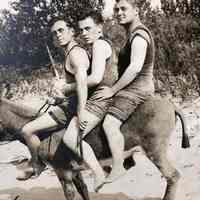          Tieler Niedzwiecki Dynamite postcard 1909; Three men in swimsuits aboard Dynamite
   