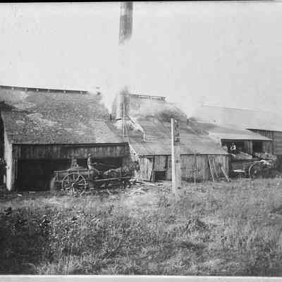 sk 142 Griffen & Henry mill.jpg 513KBfrom RJ&Diane Peterson collection. Digital file on Jack Sheridan Drive 2021.72.02: A man drives a horse-drawn wagon along the mill
