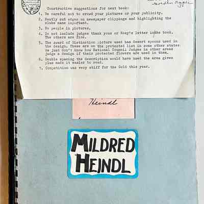 1975 home tour scrapbook in pale blue spiral-bound folder marked Mildred Heindl: Tour visited the Roger Brower and Dwayne Weeks home at 412 Francis St., Clyde and Elita (Bird) Graves home at 290 Spear St., R.E. Person home at 844 Holland Street (behind the Grist Mill), Leslie Morey home at 2801 Lakeshore Drive in Douglas, Ray Fara home at 649 Pleasant Ave., and W.D. Corlett Jr. home at corner of Main and South Streets in Douglas.