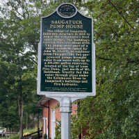          2022; Cast metal Michigan Historic Site marker number L2284 documenting the history of the Saugatuck Pump House. The site entered the national registry in 2015 and the single-post marker was erected in 2016 in the category Industry and Invention (1875-1915)
   